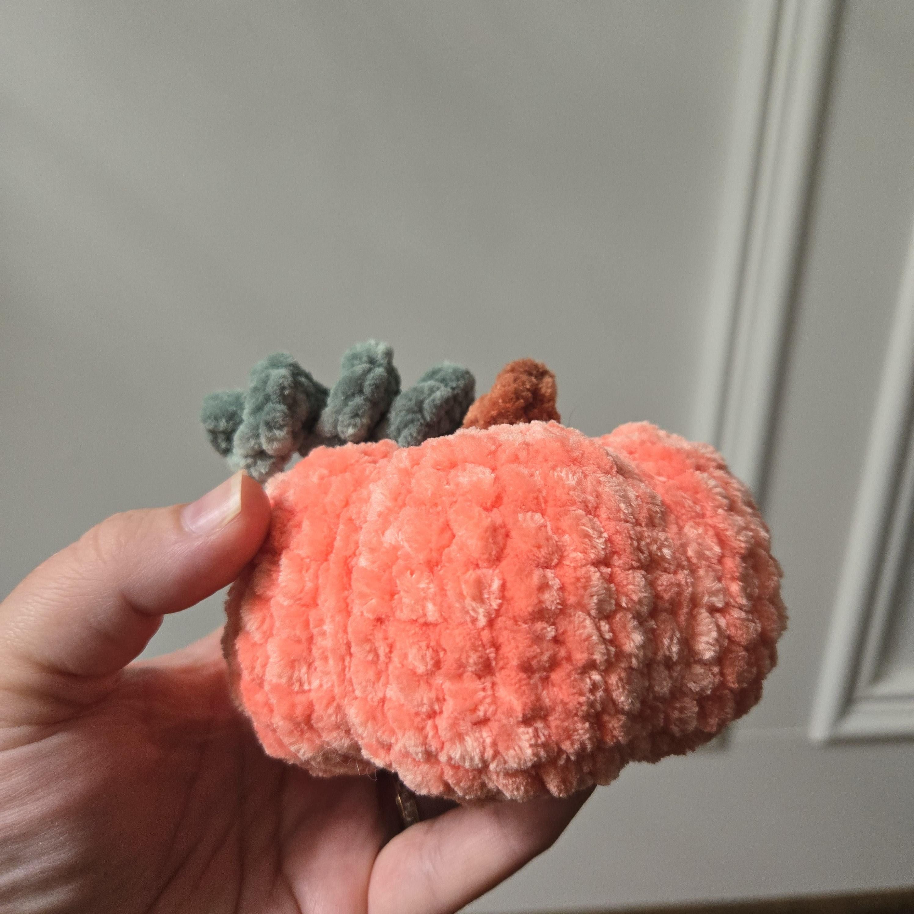 Handmade Crochet Pumpkin Plush: Amigurumi Fall Decor Toy.