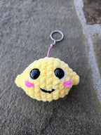 Crocheted Lemon Keychain Plush – Handmade Amigurumi Citrus Fruit Charm Accessory.