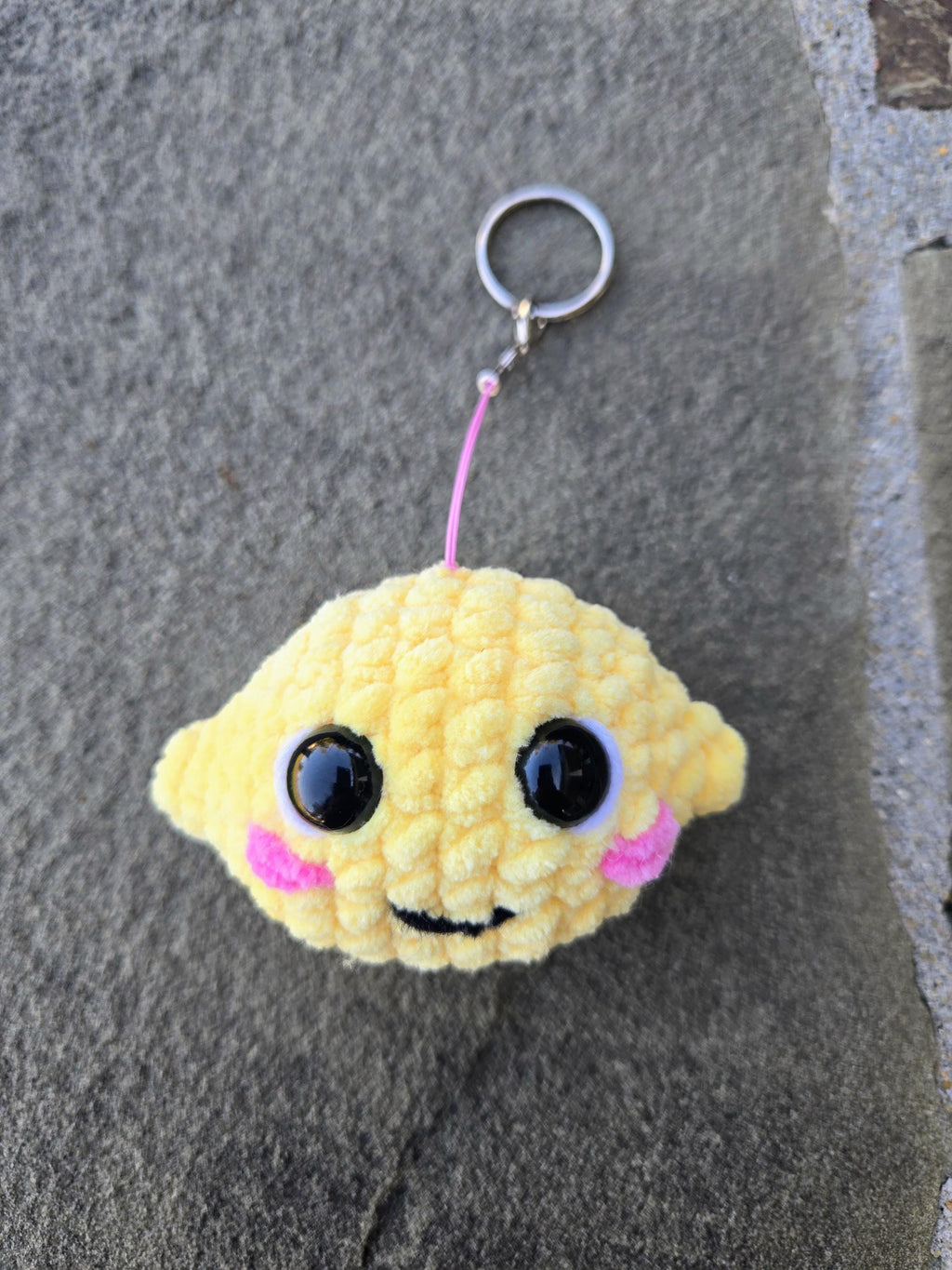 Crocheted Lemon Keychain Plush – Handmade Amigurumi Citrus Fruit Charm Accessory.