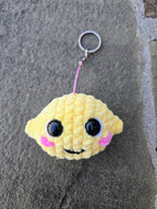 Crocheted Lemon Keychain Plush – Handmade Amigurumi Citrus Fruit Charm Accessory.